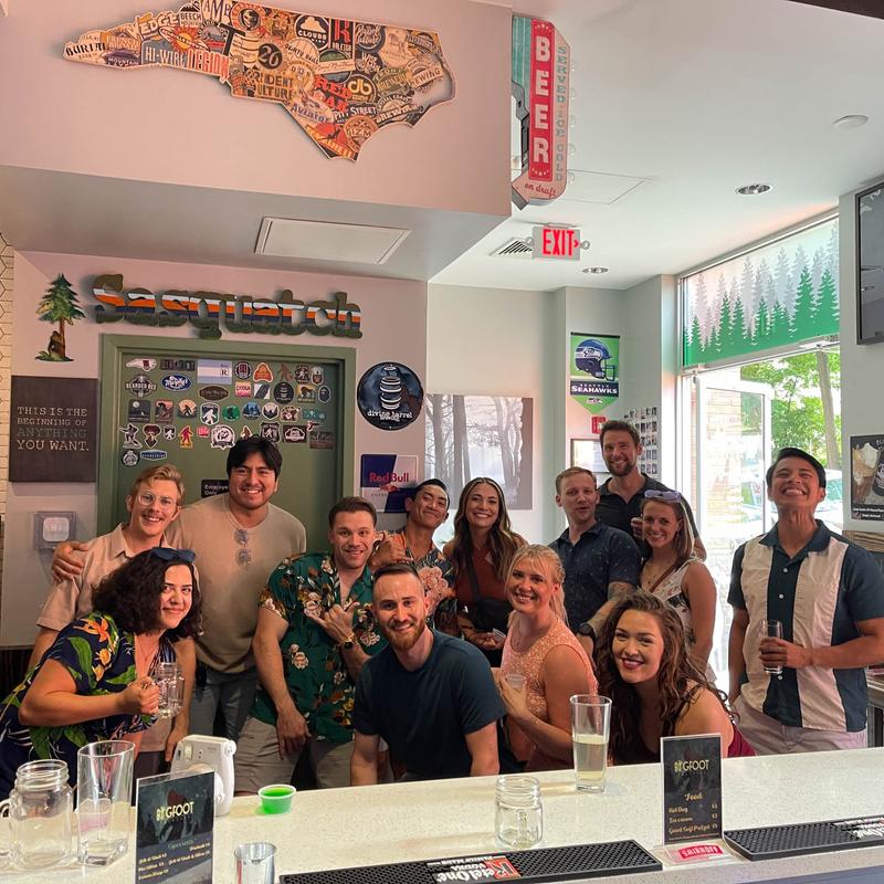 Jolly staff members posing together for the photo